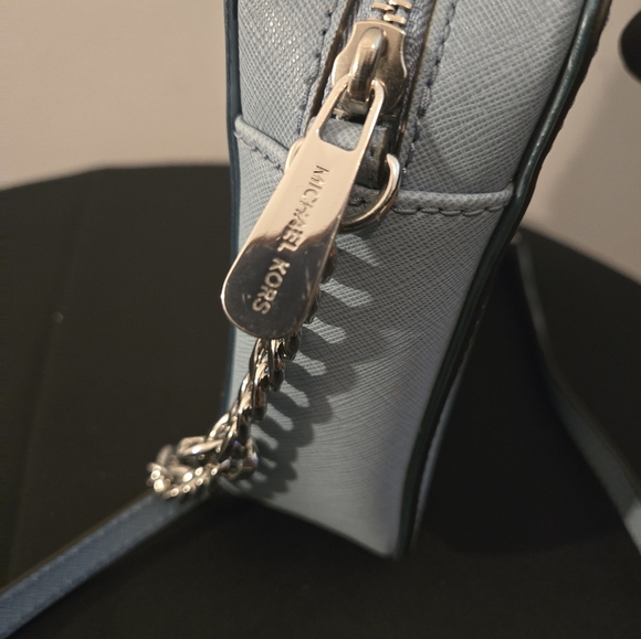 The Michael Kors Jet Set Travel Crossbody Bag in light blue - Picture 9 of 12